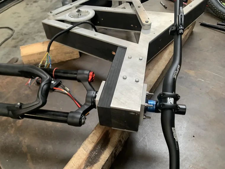 The aluminum frame with handlebars fitted, seen from above.
