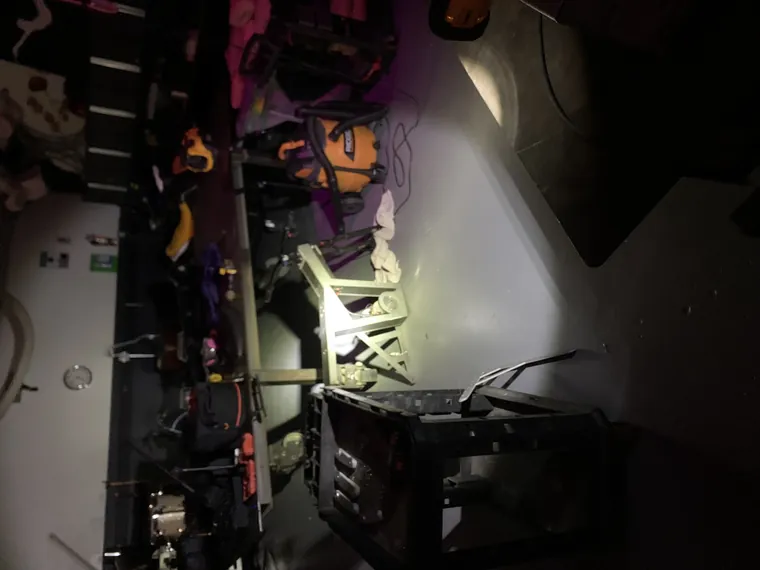 The workshop shelving in low light with the frame in the foreground.